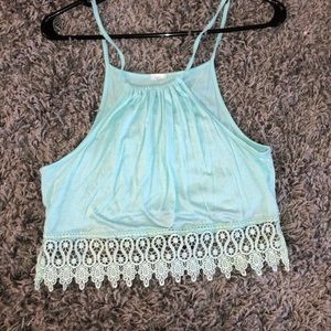 Turquoise crop top with lace design